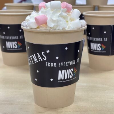 A cup of hot chocolate with a slip on for Ashgate Hospice