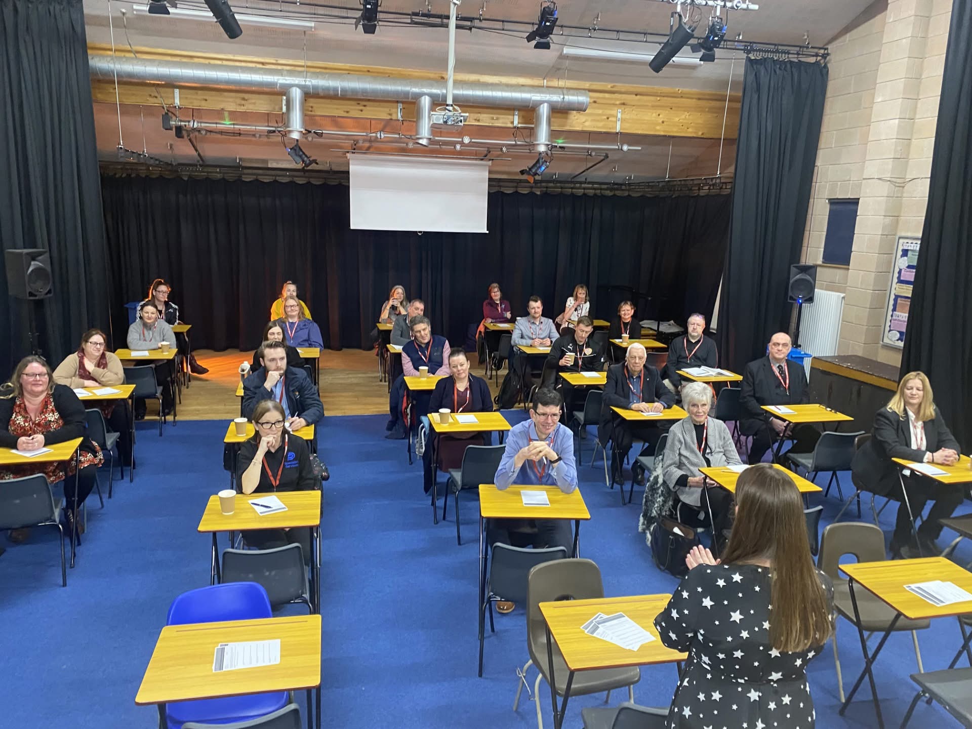 A group of Business people in the Highfields School Drama Room